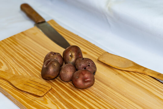 regional potatoes from the Andes at a market in Peru, Bolivia, Argentina, south america on a wooden table. Selective focus