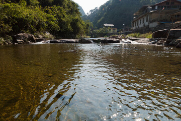 A small river that flows through a valley