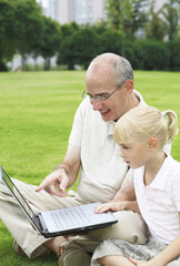 Father and daughter surfing the internet