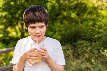 A boy drinking lemonade