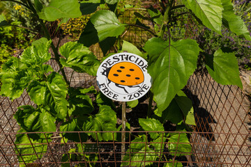 Pesticide free zone sign in a garden