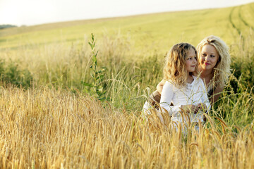 Woman and girl in a wheat field