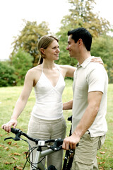 Couple and a bicycle in the park