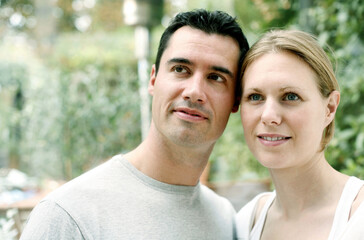 Fototapeta premium Couple smiling while looking up