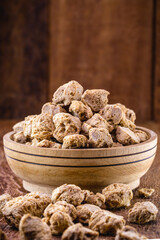 vegan food, coarse soy protein, also called soy meat, the protein textured in pieces inside a wooden bowl