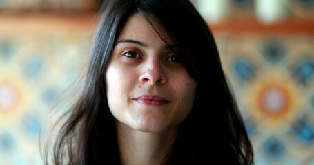 Person removing covid-19 face mask, end of pandemic concept. Attractive woman takes off mask