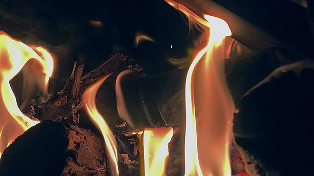Fire slowly burning in the fire pit shot in slow motion 120fps.