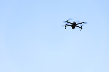 Fototapeta premium Drone quad copter flying with blue sky.