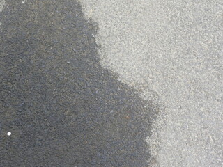 Oil spills on asphalt road