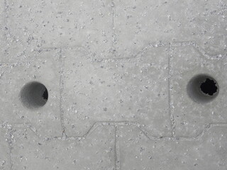 Abstract gray color concrete floor textured background with holes