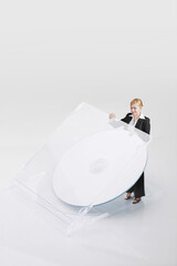 Businesswoman taking out DVD from the case