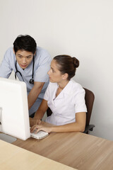 Doctor and nurse using computer