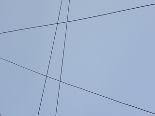 Electrical cables on blue sky background