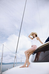 Woman posing on a yacht