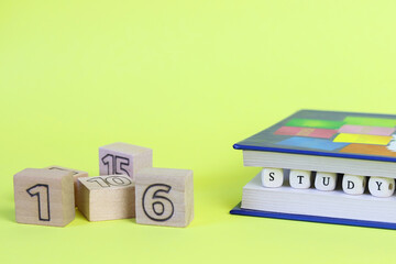 The word learning from letters written on wooden cubes. Defocused numbers. Copy space - concept of education, child development, back to school