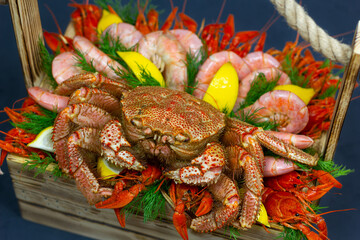 seafood basket, shrimp, crab, crayfish and lemon