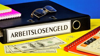 Arbeitslosengeld - text label on the folder office of the Registrar. Compensation paid to employees...