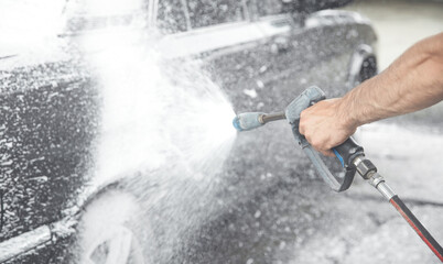 Car washing. The washing process on a self service car wash
