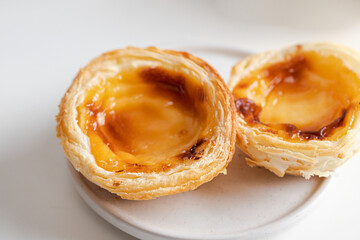 Close up  of Pasteis de Belem, Portuguese egg tart pastries, making using traditional methods and according to the Jeronimos Monastery secret recipe.