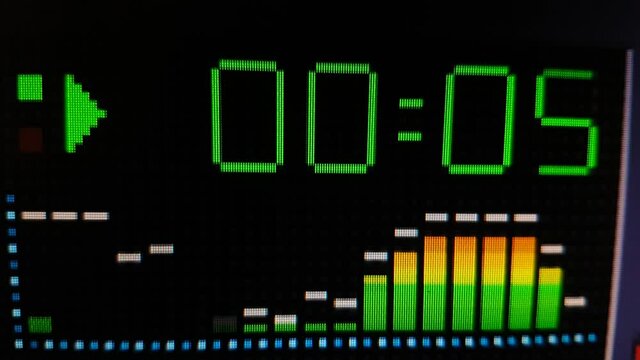 Close up of time counter on computer media player with spectrum analyzer, audio software