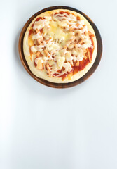 pizza on white background from top view.