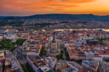 Fototapeta na wymiar Budapest, Hungary - Aerial panoramic view of Budapest with a magnificent golden sunset. The view includes St.Stephen's Basilica, Szechenyi Chain Bridge and ferris wheel at Elisabeth Square at summer