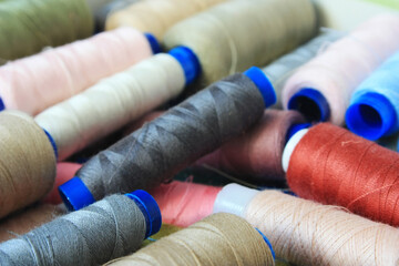 Fototapeta na wymiar Spools of thread for sewing