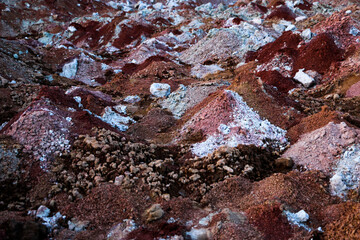 textures of various clay layers underground in  clay quarry after  geological study of  soil. colored layers of clay and stone in  section of  earth, different rock formations and soil layers.