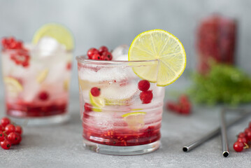 summer cocktail with red currants, lime and syrup