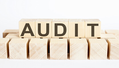 AUDIT word from wooden blocks on desk, search engine optimization concept