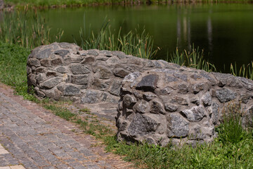 stone fence in a green park