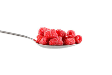 Raspberry in stainless steel spoon isolated against white background.