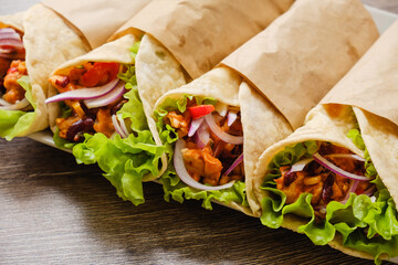 Mexican burrito with chicken, pepper and beans close up