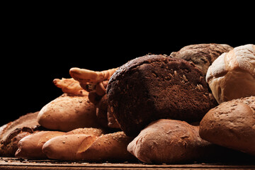Fragrant bread on the table. Food concept on black
