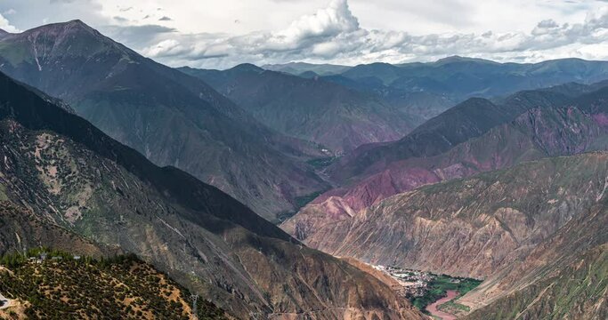 4K, 10bit, YUV422 timelapse of Western Sichuan landscape with mountains and moving clouds in daylight, Sichuan, China