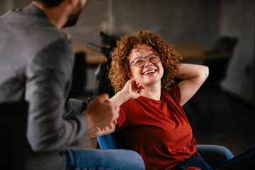 Colleagues working on the project. Businesswoman and businessman discussing work in the office.	
