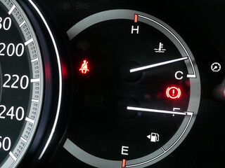 closeup of car signal lights on car dashboard.