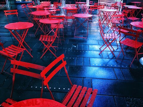 High Angle View Of Empty Chairs And Tables At Sidewalk Cafe