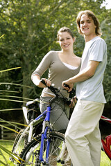 Teenage couple with their bicycles