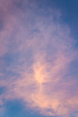 Pink sunset sky with pearly clouds