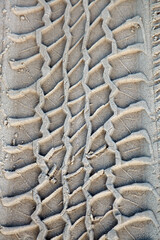Distinct prints of 4 wheel driving tracks on sand