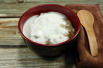 Traditional Thai sweet dessert made from coconut milk, Job's tear, fresh sweet corn, taro, potato and syrup. Famous local tropical snack in Asia. 