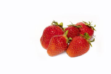 heap of ripe red strawberries isolated on white background
