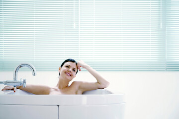 Woman relaxing in the bathtub