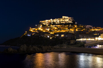 A panoramic view of Castelsardo, Italy, by night