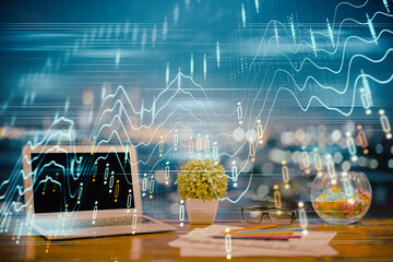 Forex graph hologram on table with computer background. Double exposure. Concept of financial markets.