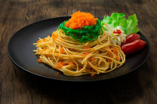 Spaghetti Ebiko and Seaweed salad decorate Leek flower shape and vegetable. Japanese combination italian Food