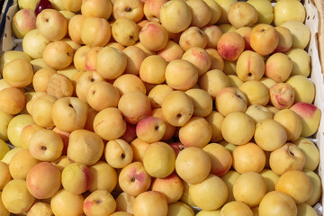 Peaches, nectarines on the counter of a street market.
