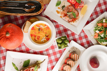 Traditional Italian cuisine, Italian concept. Sea food soup, grilled meat, traditional bruschetta.