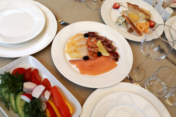 Dining table with various appetizers